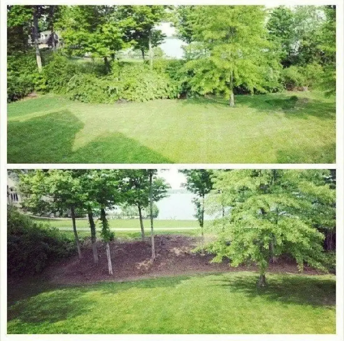 Fresh mulch bed with new plantings and a stone birdbath installed by Mike Green Lawn Care in Hamilton County, IN